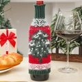 Detailed shot of a festive knitted Christmas tree wine bottle cover on a holiday table. - Christmas Tree