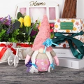 Pink and grey gnome plush with long braids and flower details for festive home decoration - Purple Flower Gnome Pink (Pink Hat With Braids)