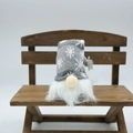 Christmas gnome doll with gray snowflake knit hat and white beard on wood bench - Glowing Short Leg Grey