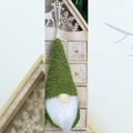 Detail of a Christmas gnome ornament featuring a green knit hat and white plush beard - Dark Green (Style G)