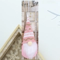 Detail of pink knitted Christmas gnome ornament with snowflake pattern and long white beard - Pink White Snowflake (Style P)