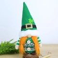 Close-up of St. Patrick's Day gnome with green clover hat and wooden base decor - Belt Pointed Hat Girl Gnome