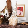 Detail of coffee themed Christmas gnome with knitted hat and plush beard on home shelf - Male Coffee Gnome Doll