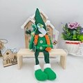 Detail of St. Patrick's Day gnome featuring green sequin hat and orange braids - Female Style