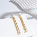 Long tassel earrings with pearl top and gold chains on a minimalist display - Gold Square Style (ER-773)
