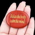 Polished red natural palm stone with gold Relax the body calm the mind engraving - Red Jasper