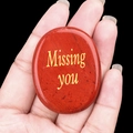 Red Jasper healing stone with golden Missing You text shown in a hand palm - Red Jasper