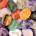 Polished natural palm stones set with golden Om Mani Padme Hum Tibetan carvings - Random Color One Piece