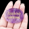 Polished purple amethyst palm stone with Relax the body calm the mind golden engraving - Amethyst