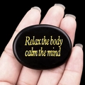 Black palm stone with gold engraved text Relax the body calm the mind for meditation - Obsidian