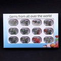 Set of 12 hand-carved gemstone elephant figurines in a white window display gift box - Set of 12 / African Blood Stone
