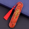 Oval resin bookmark featuring Tree of Life charm, red agate stones, and a long red tassel - Red Jasper Style (2153)