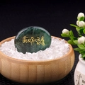 Polished green aventurine palm stone with golden Om Mani Padme Hum mantra carving - India Agate