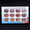 Set of 12 carved gemstone elephants in a white gift box with various natural stones - Set of 12 / Colored Jade