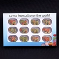 Set of 12 hand-carved gemstone elephant figurines in a white windowed gift box - Set of 12 / Unakite
