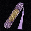 Handmade resin bookmark featuring natural purple amethyst stones and gold tree of life symbol - Amethyst