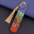 Oval resin bookmark with colorful chakra stones, golden tree of life, and vibrant tassel - Seven Chakra Stone Style (2153)