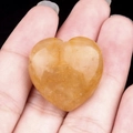Polished natural orange calcite heart pendant with 3mm horizontal hole and unique texture - Yellow Jade