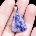 Blue sodalite trapezoid stone pendant with silver bail shown in hand for size - Sodalite