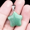 Star-shaped green semi-precious stone pendant with silver clasp held in hand - Green Aventurine / 20mm