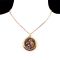 Golden round locket necklace filled with tiger eye natural stones on a neck model - Tiger's Eye