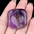 Handheld square amethyst gemstone pendant with polished rounded corners and center hole - Amethyst
