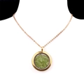 Golden round pendant necklace with green crystal stone filler on white model - Peridot Crystal