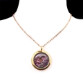 Golden locket necklace with mixed natural crystal stones on a white background - Tourmaline