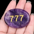 Natural purple crystal palm stone with engraved golden number 777 for meditation - Amethyst