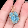 Handmade gold wire-wrapped blue raw crystal pendant with natural mineral stone - Apatite
