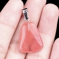 Pink natural crystal trapezoid pendant with silver metal bail on hand display - Watermelon Red (Synthetic)