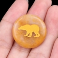 25mm translucent orange agate stone disk with a textured golden bear inlay design - Topaz