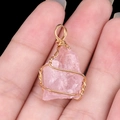 Handmade rose quartz wire wrapped pendant in golden finish with irregular crystal stone - Rose Quartz