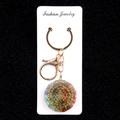 Chakra resin keychain with colorful natural stones and golden geometric patterns - Metatron's Cube Style (No. 1)
