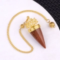 Gold-tone lotus pendulum pendant featuring sparkling brown goldstone with an Om symbol - Gold Sandstone (Synthetic)