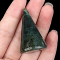 Handheld view of a polished green moss agate stone ring holder in conical shape - India Agate