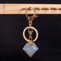 Golden diamond resin keychain with light blue natural crystal stones and copper coil - Aquamarine