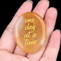 Polished natural orange quartz stone with gold one day at a time engraving - Yellow Jade