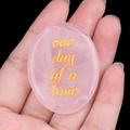 Pink rose quartz palm stone engraved with One day at a time golden inspirational text - Rose Quartz