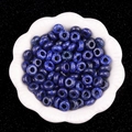 Dunkelblaue 5x10mm Kristallperlen mit großem Loch in einer weißen Keramikschale - 5X10mm Lapislazuli-Optik