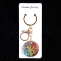 Octagon resin keychain with colorful healing crystals and golden geometric symbol - Octagonal Energy Stone Style (No. 7)