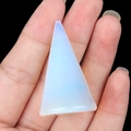 Polished triangular opal gemstone holder with milky white and blue translucent finish - Opal (Synthetic)