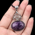 Vintage purple crystal gourd pendant necklace with silver hollow accents on hand - Amethyst