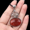 Red agate shell pendant with silver metal setting and black woven cord necklace - Red Agate