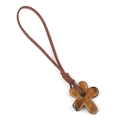 Handcrafted tiger eye stone flower pendant with dark brown cord on white background - Tiger's Eye