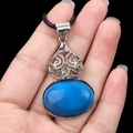 Ethnic vintage oval blue agate pendant with silver alloy hollow pattern on black cord - Blue Agate