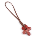 Ethnic style flower pendant made of polished reddish brown stone with suede cord - Red Jasper