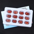 Set of 12 hand-carved red jasper pig figurines in a white display tray storage - Red Jasper