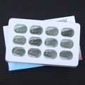 Set of 12 hand-carved green aventurine wolf figurines displayed in a white organizer tray - Green Aventurine