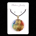Pendentif énergétique octogonal en résine avec pierres naturelles et symbole triskèle doré - No. 25